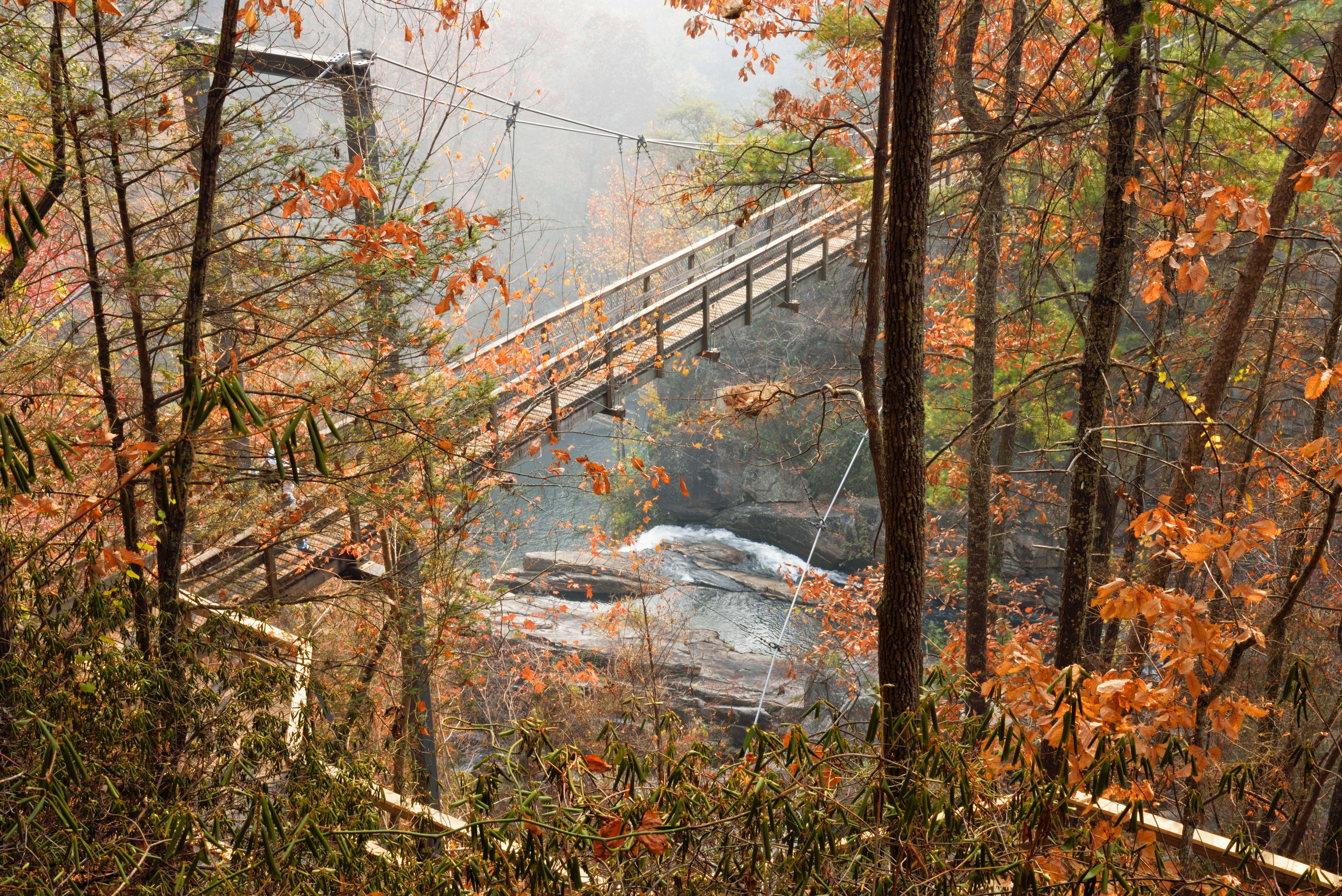 The Tallulah River runs under a suspension bridge at Tallulah Gorge in Georgia USA.