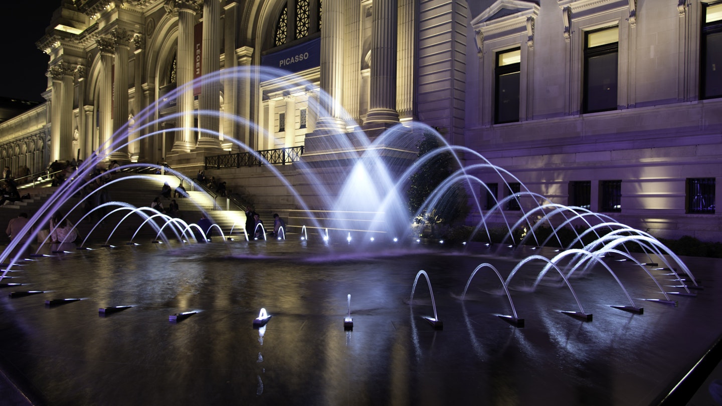 Illuminated fountain at entrance to Metropolitan Museum of Art, New York City, New York State, USA