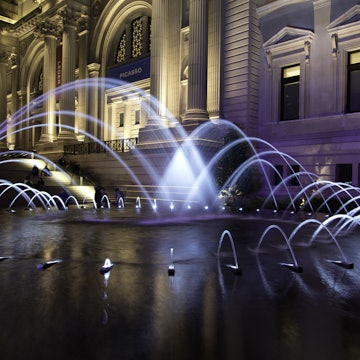 Illuminated fountain at entrance to Metropolitan Museum of Art, New York City, New York State, USA