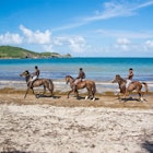 horseback riding trio on Cas En Bas beach ; beautiful afternoon