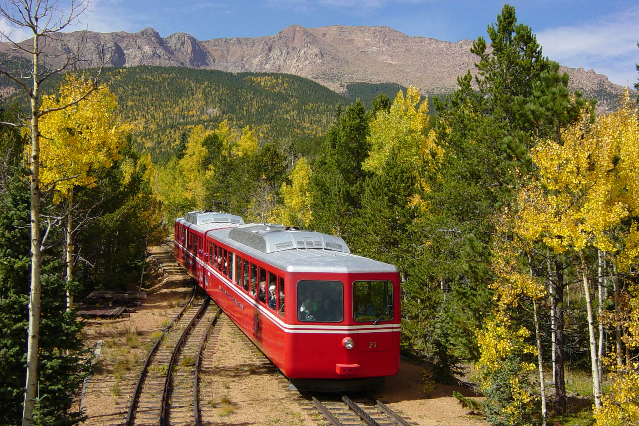 The Broadmoor Manitou and Pikes Peak Cog Railway traveling through Pikes Peak in Colorado