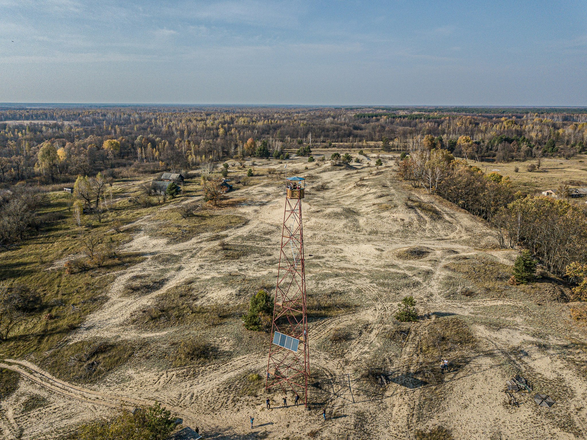 A firetower stands with Chernobyl somewhere in distance. 