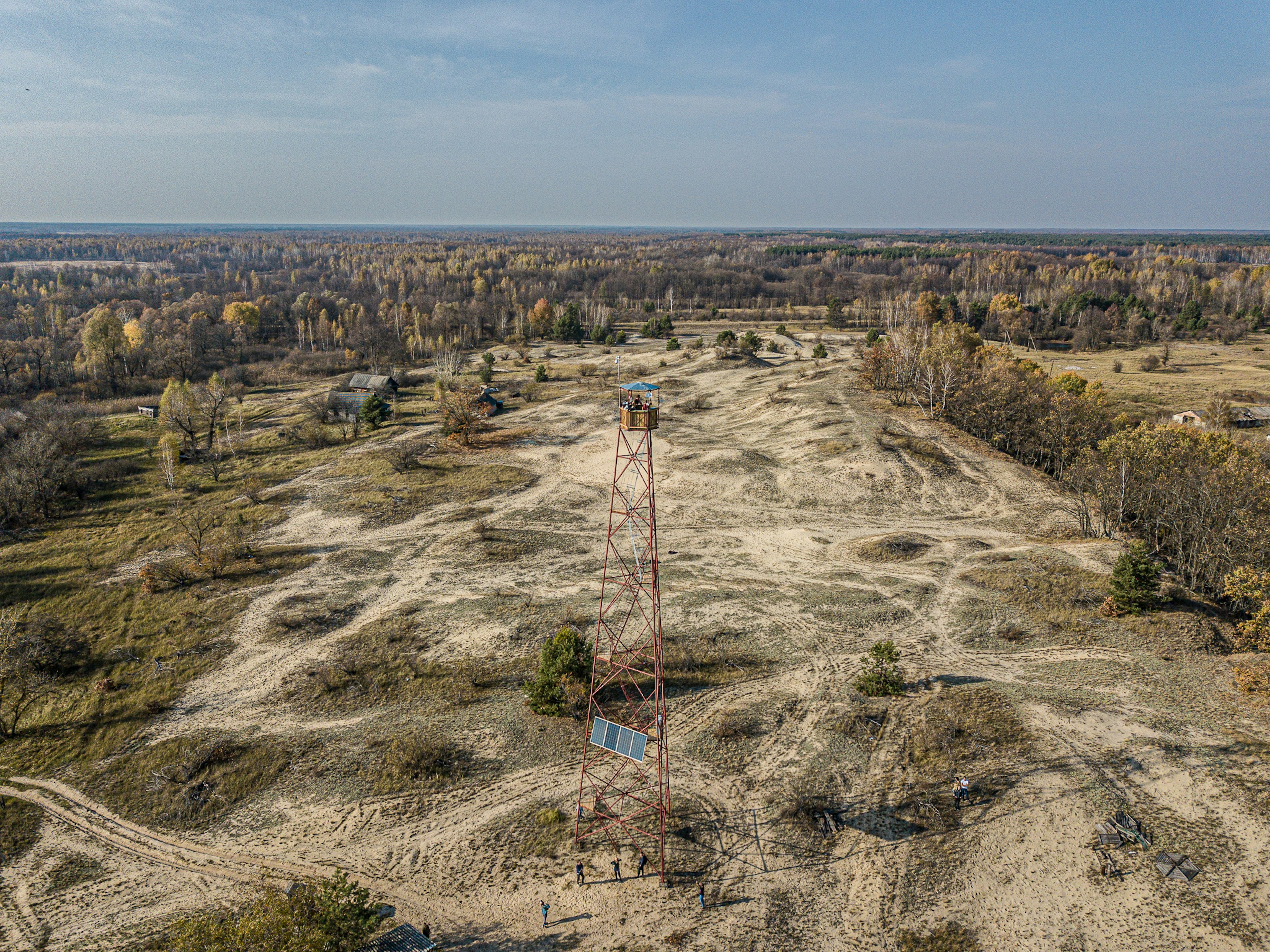 A firetower stands with Chernobyl somewhere in the distance.