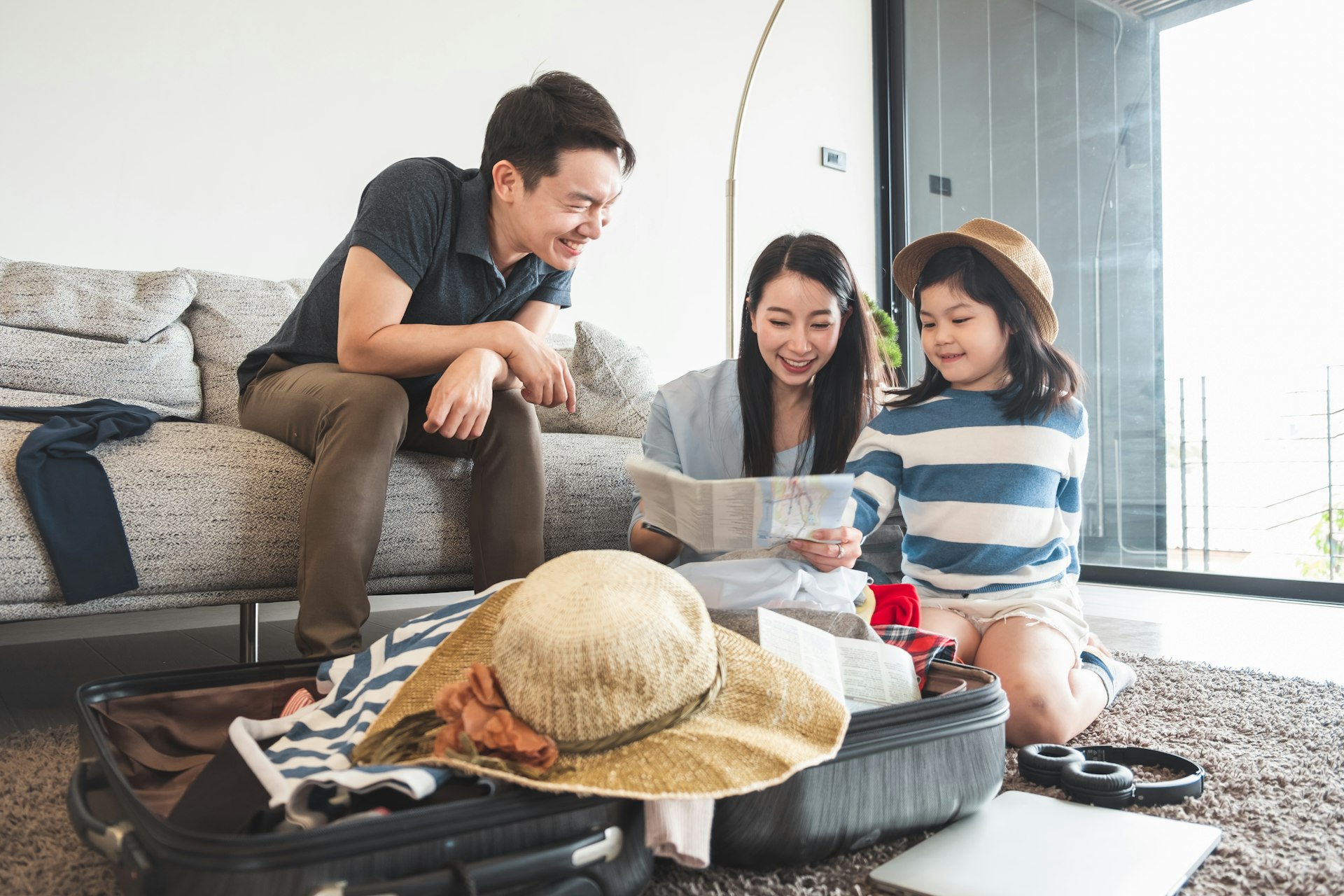 Family unpacking bag/luggage and planning their day