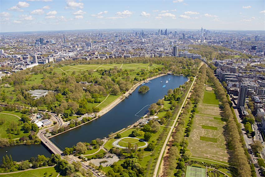 Aerial photography view north-east of Hyde Park and the Serpentine. London SW7, UK. Aerial shot of a large park dominated by a central L-shaped lake
