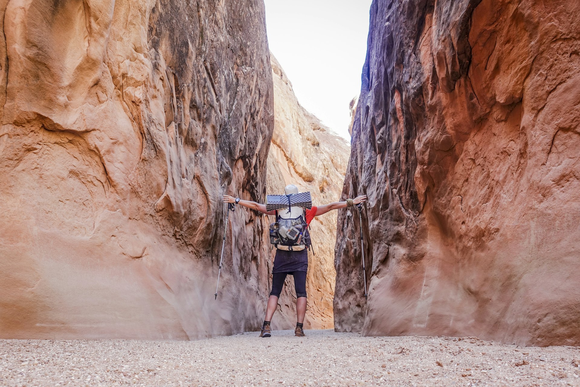 Backpacker in narrow canyon in Utah