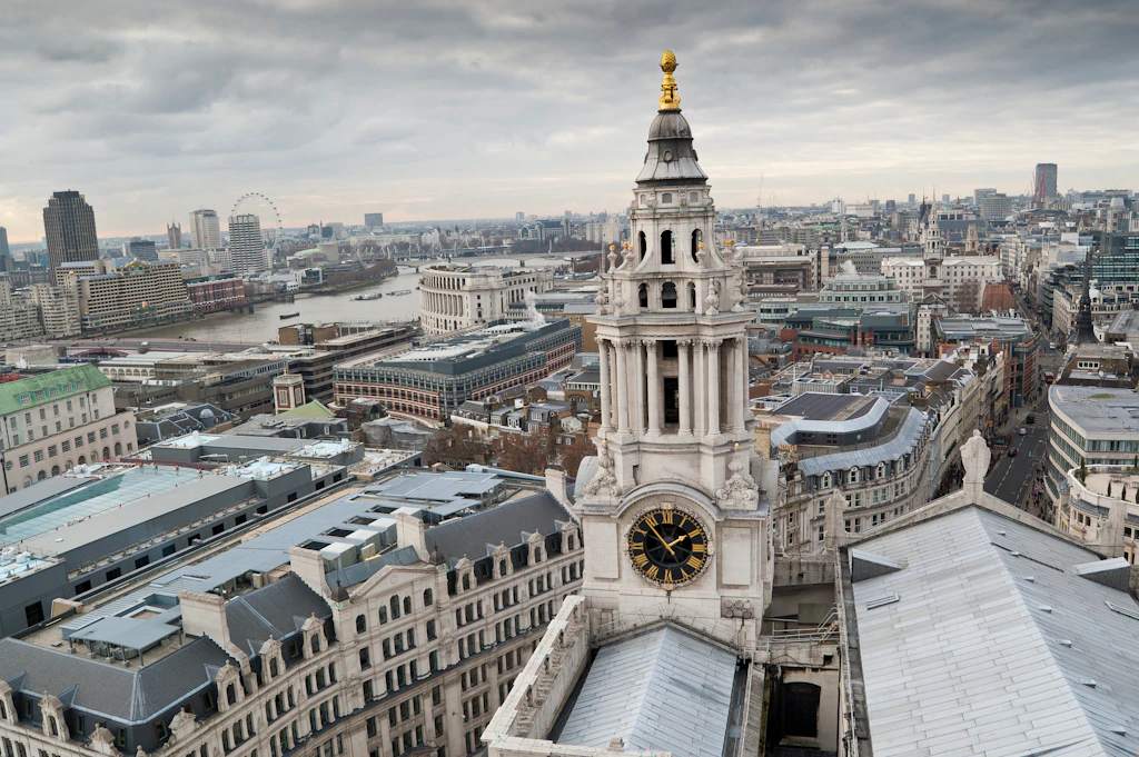 View of the City of London A view over city rooftops, with a nearby large clock tower topped with gold dominating the shot