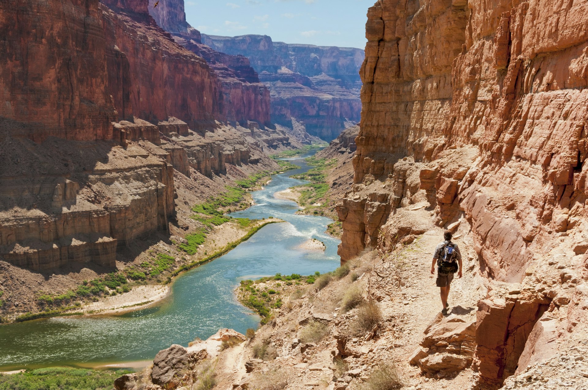 Man hikes to Puebloean Granaries along Colorado River