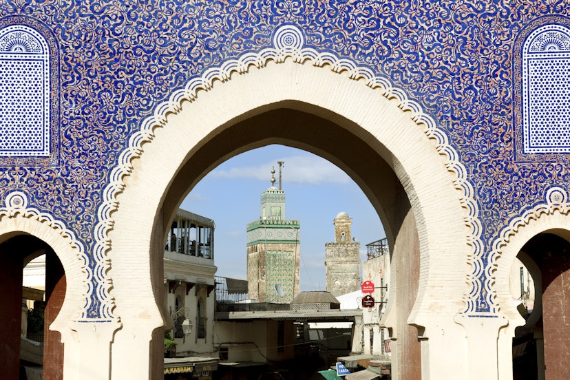 The Bab Bou Jeloud is a recent addition to Fes El Bali, having been built around 1913. The Medersa Bou Inania minaret is framed by this impressive gateway into the Medina