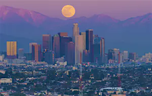 Full Moon over Los Angeles Skyline, California at Sunset