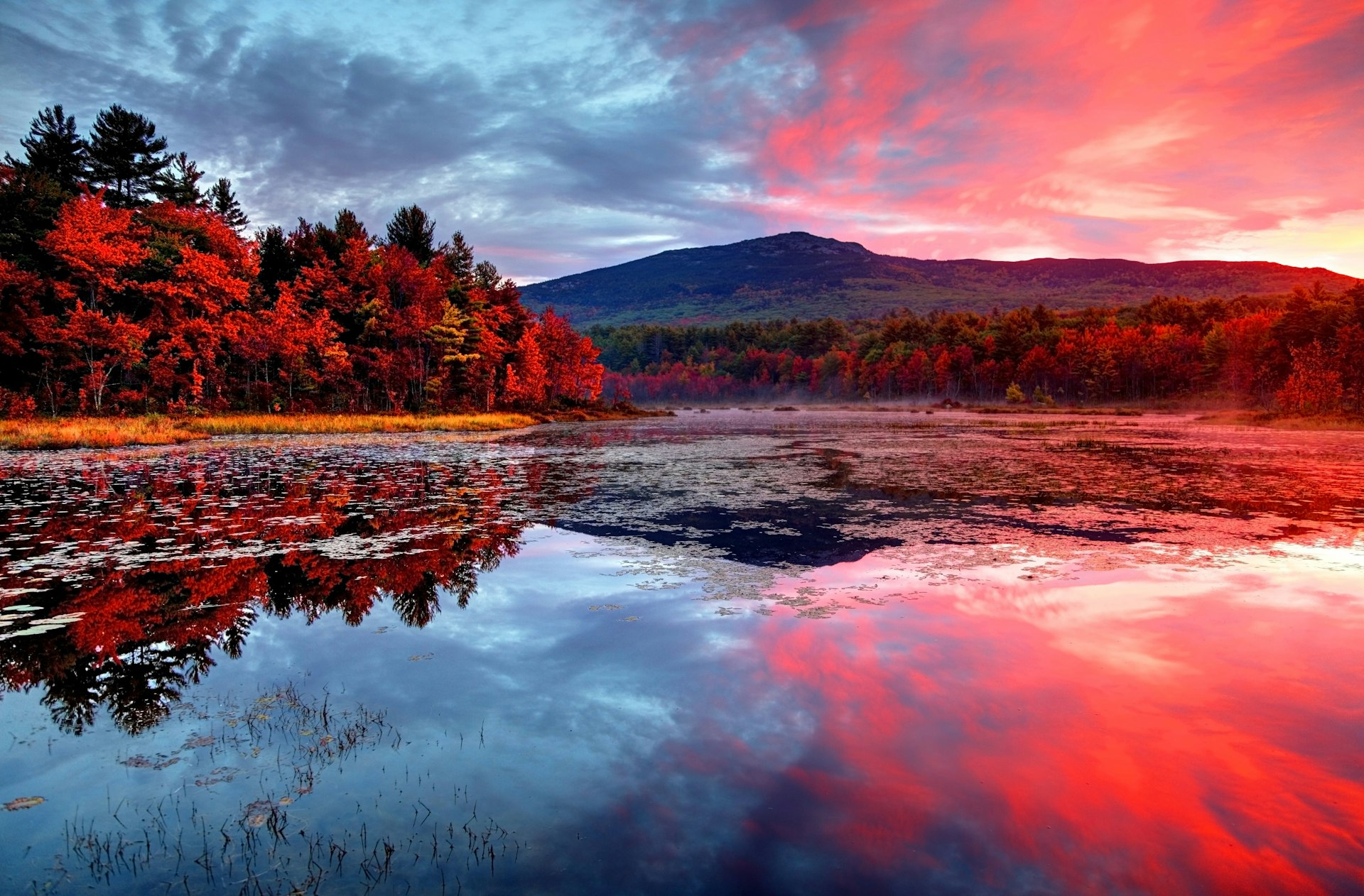 Brillaint sunset and Mount Monadnock reflecting on a small pond