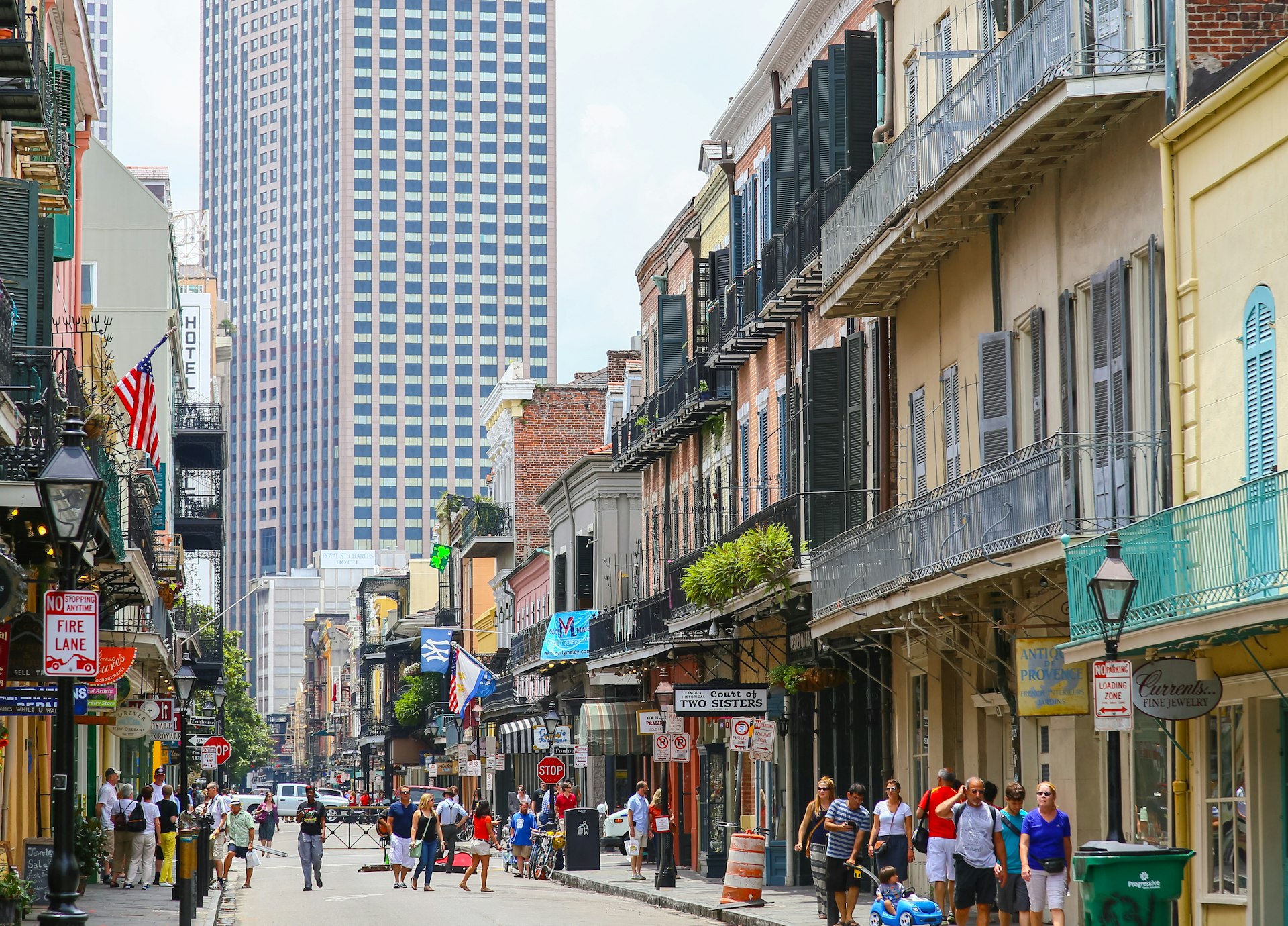 People wander down the streets of the French Quarter in New Orleans