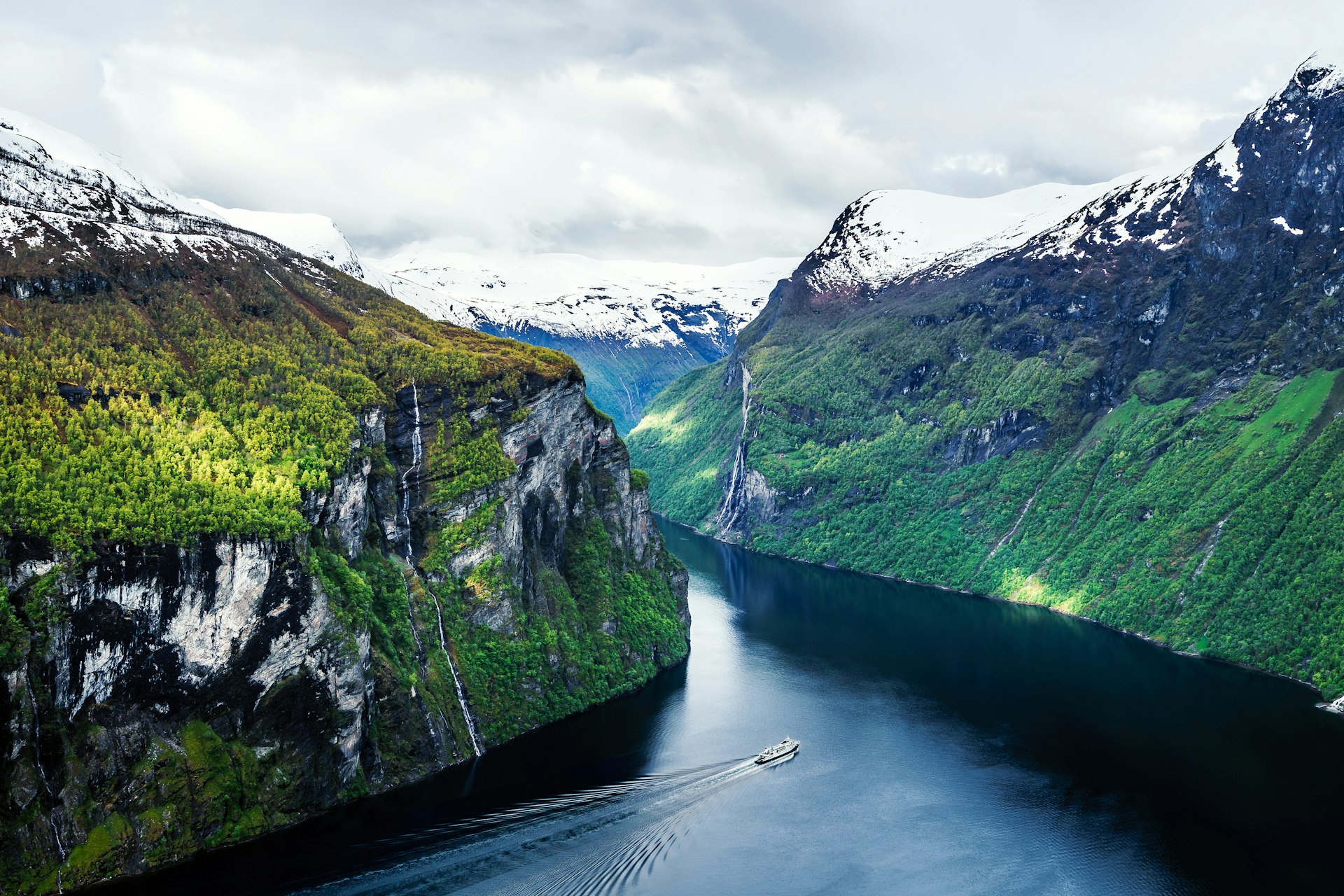 Boat cruising through Geirangerfjord in Norway