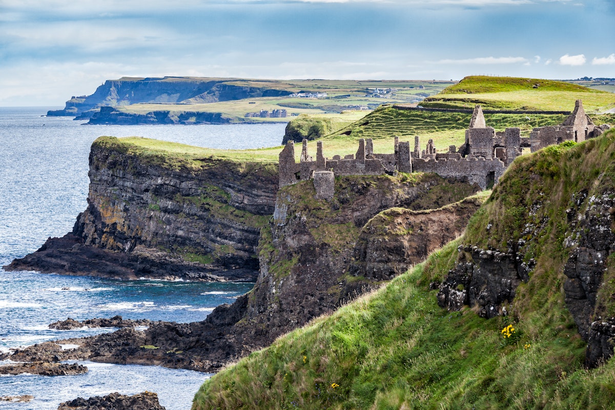 August 7, 2017: Cliffs of Northern Ireland and the ruins of Dunluce Castle Magheracross.
