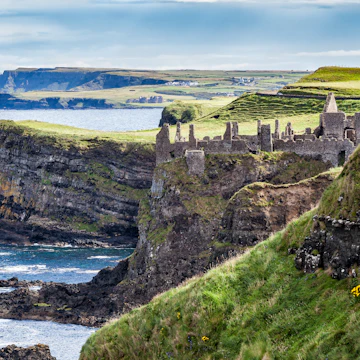 August 7, 2017: Cliffs of Northern Ireland and the ruins of Dunluce Castle Magheracross.