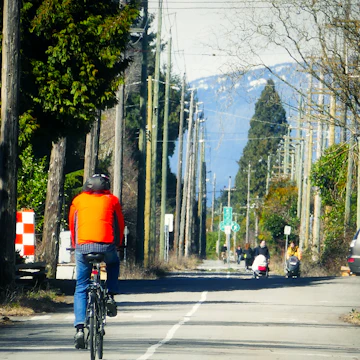 The Arbutus Greenway is transformed from historic rail corridor to a nature walkway for people to do cycling, rolling and strolling, in Vancouver BC Canada.