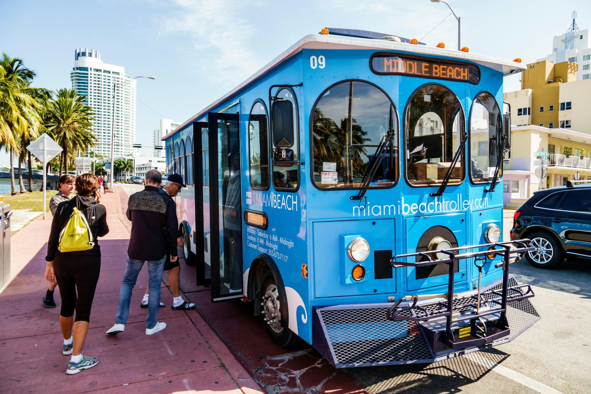 Florida, FL, South, Miami Beach, Indian Creek Drive, Middle Beach Loop, free trolley, public transportation, mass transit, bus stop, boarding, adult a