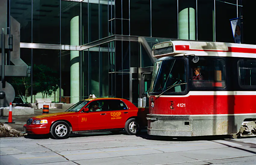 Toronto transportation Taxi and bus waiting at lights in Toronto