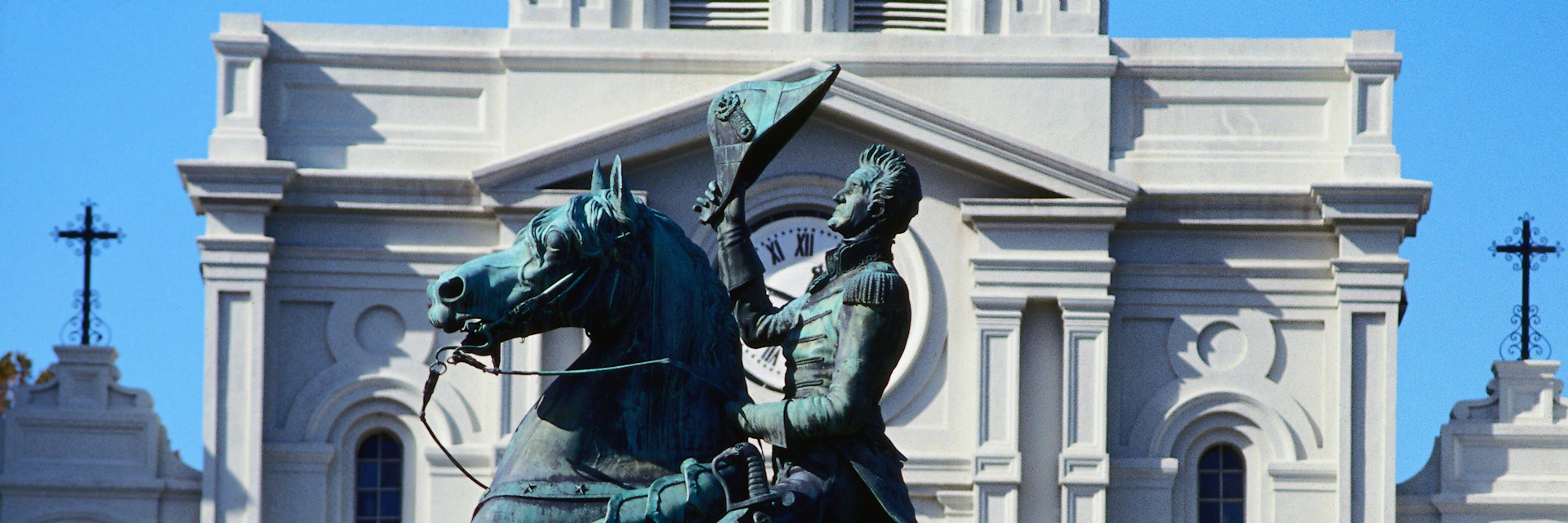 The statue in front of the grand St Louis Cathedral, built in 1794, at one end of Jackson Square in the French Quarter - New Orleans, Louisiana