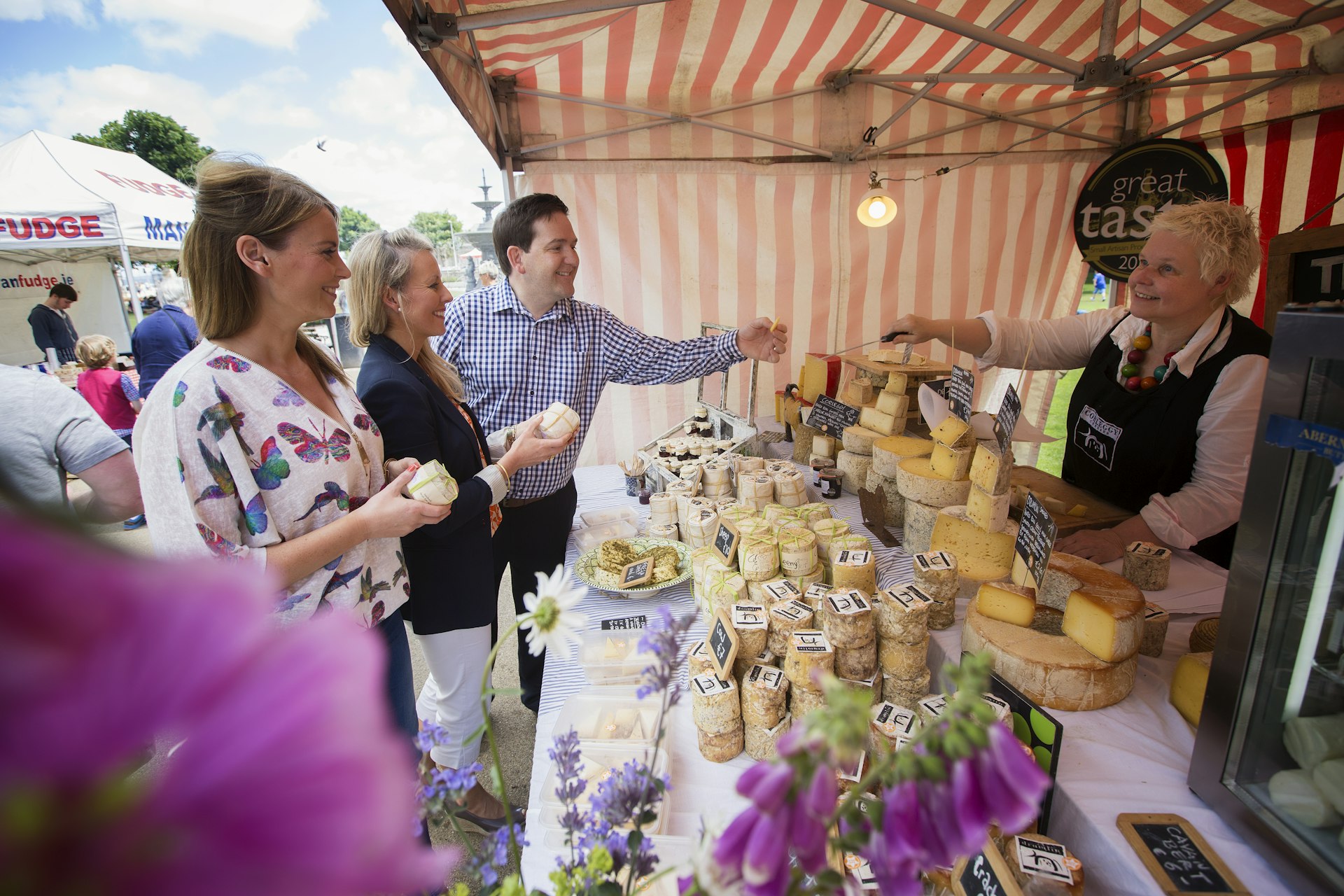 Visitors to a cheese stall at the Sunday People's Park Market in Dun Laoghaire