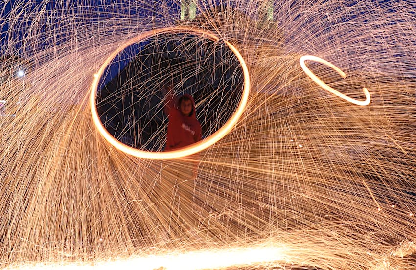Gazaian youth perform fire spinning to celebrate Ramadan