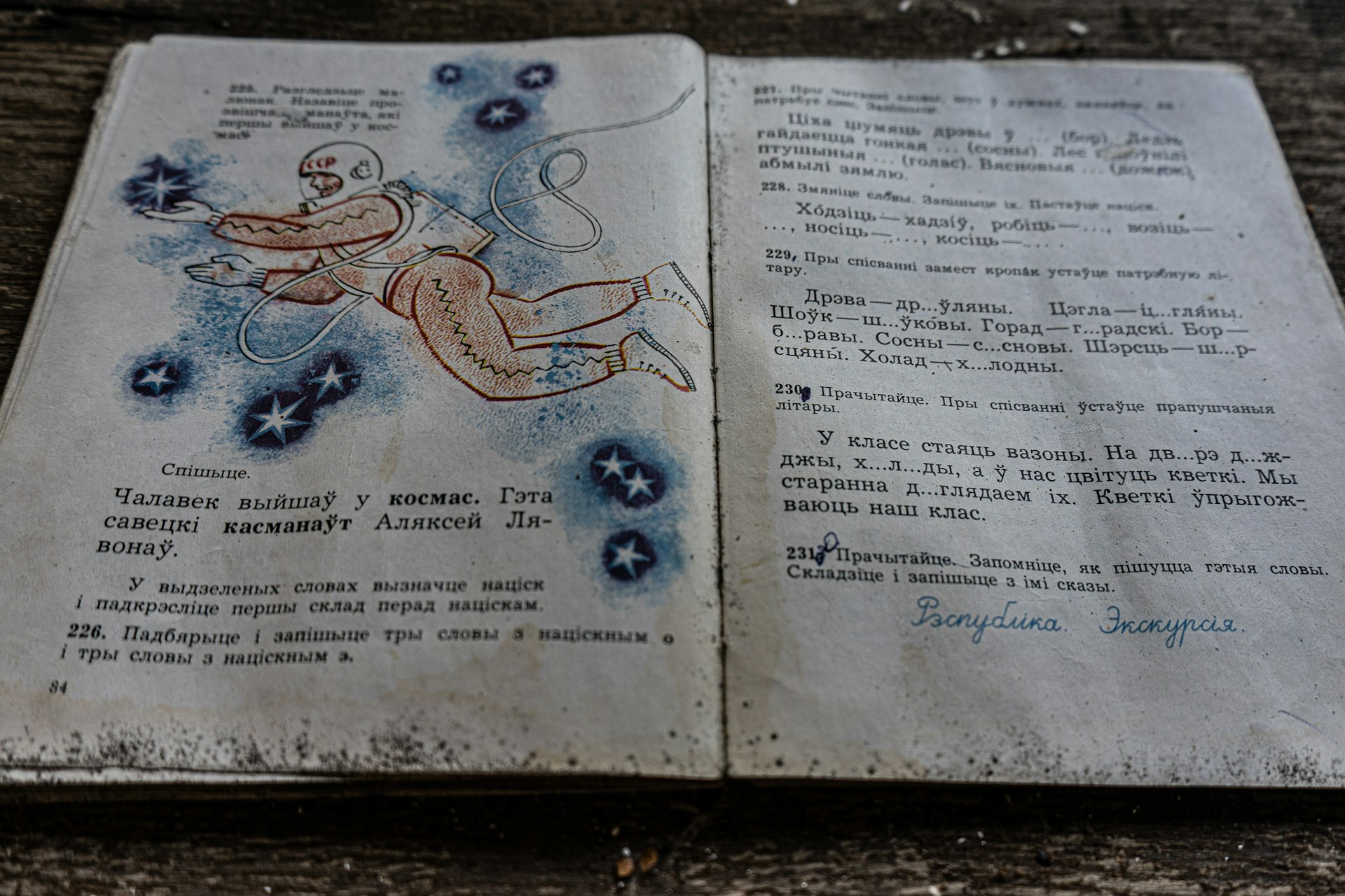 A child's school book in an abandoned school near Chernobyl shows an astronaut. 