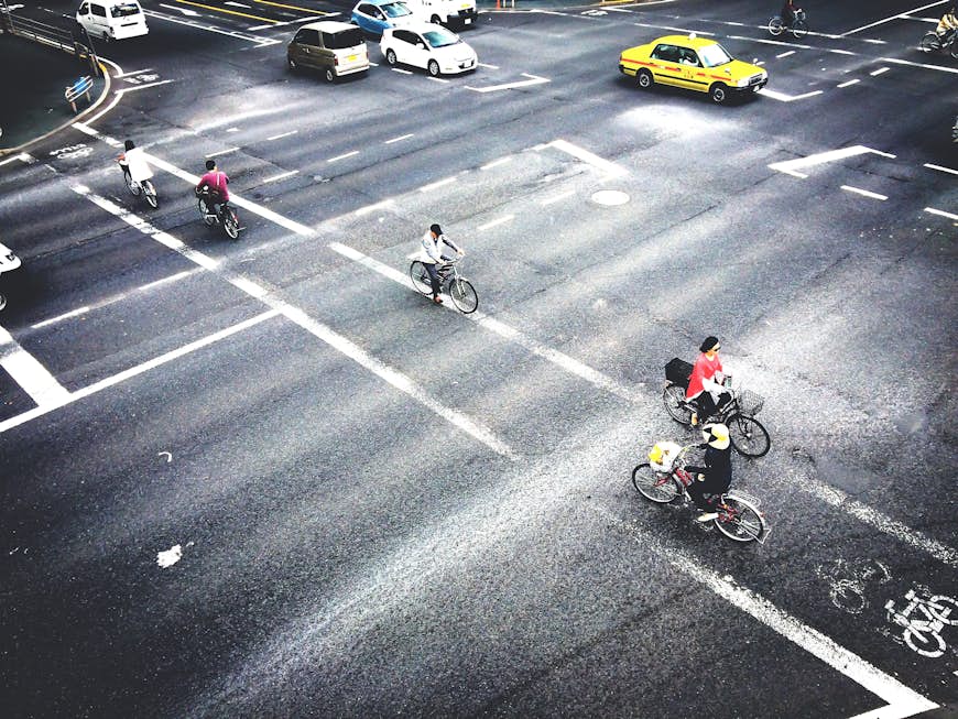 People riding bicycles in Tokyo, Japan