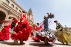 MAY 2017: Young women dance the flamenco on the Plaza de Espana.