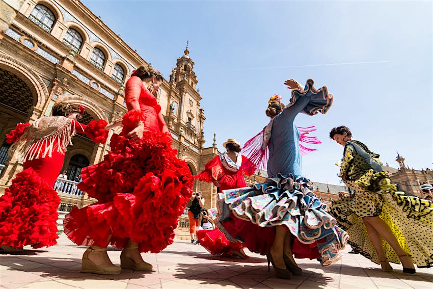 Young women dance the flamenco on the Plaza de Espana. 