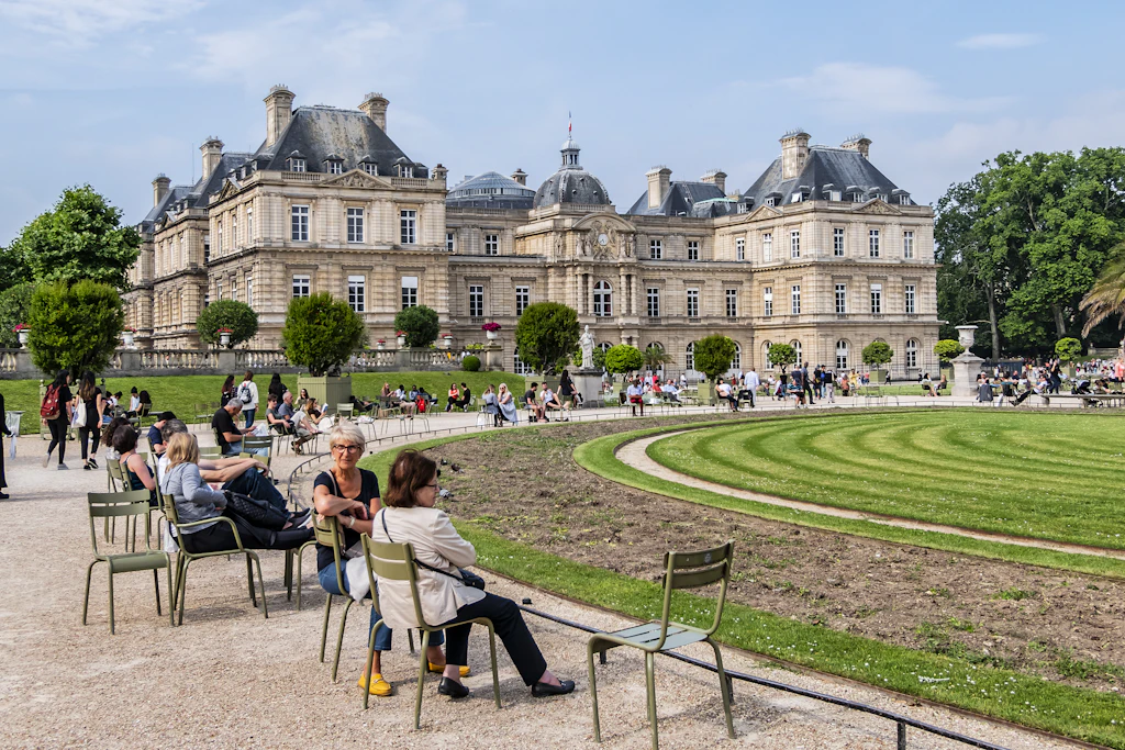 Jardin du Luxembourg People relaxing in the famous green chairs in Luxembourg Garden.