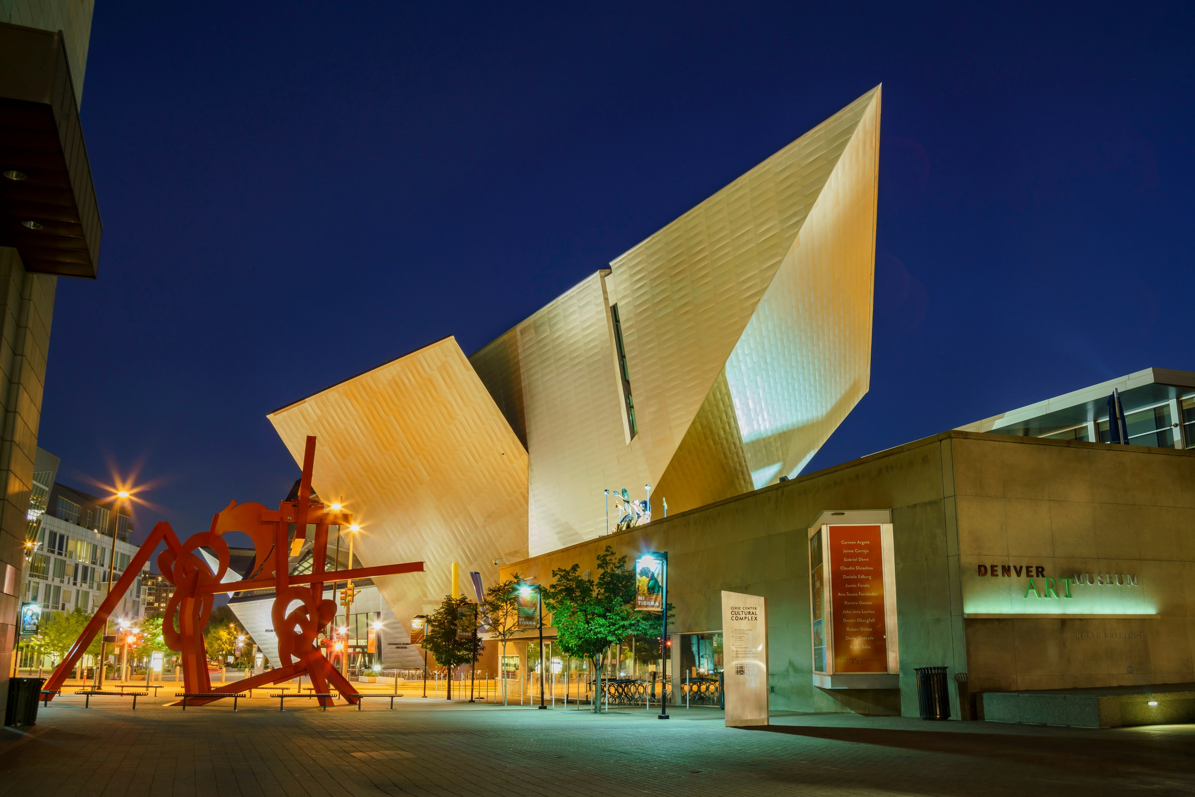 Exterior of the Denver Art Museum illuminated at night