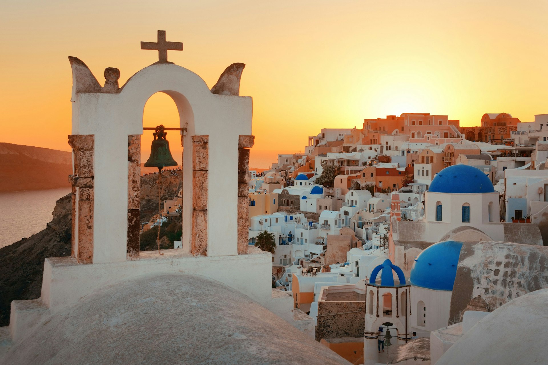 Oia skyline during sunset with church bell