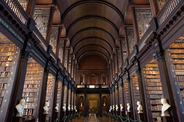 DUBLIN, IRELAND - FEB 15: The Long Room in the Trinity College Library on Feb 15, 2014 in Dublin, Ireland. Trinity College Library is the largest library in Ireland and home to The Book of Kells.