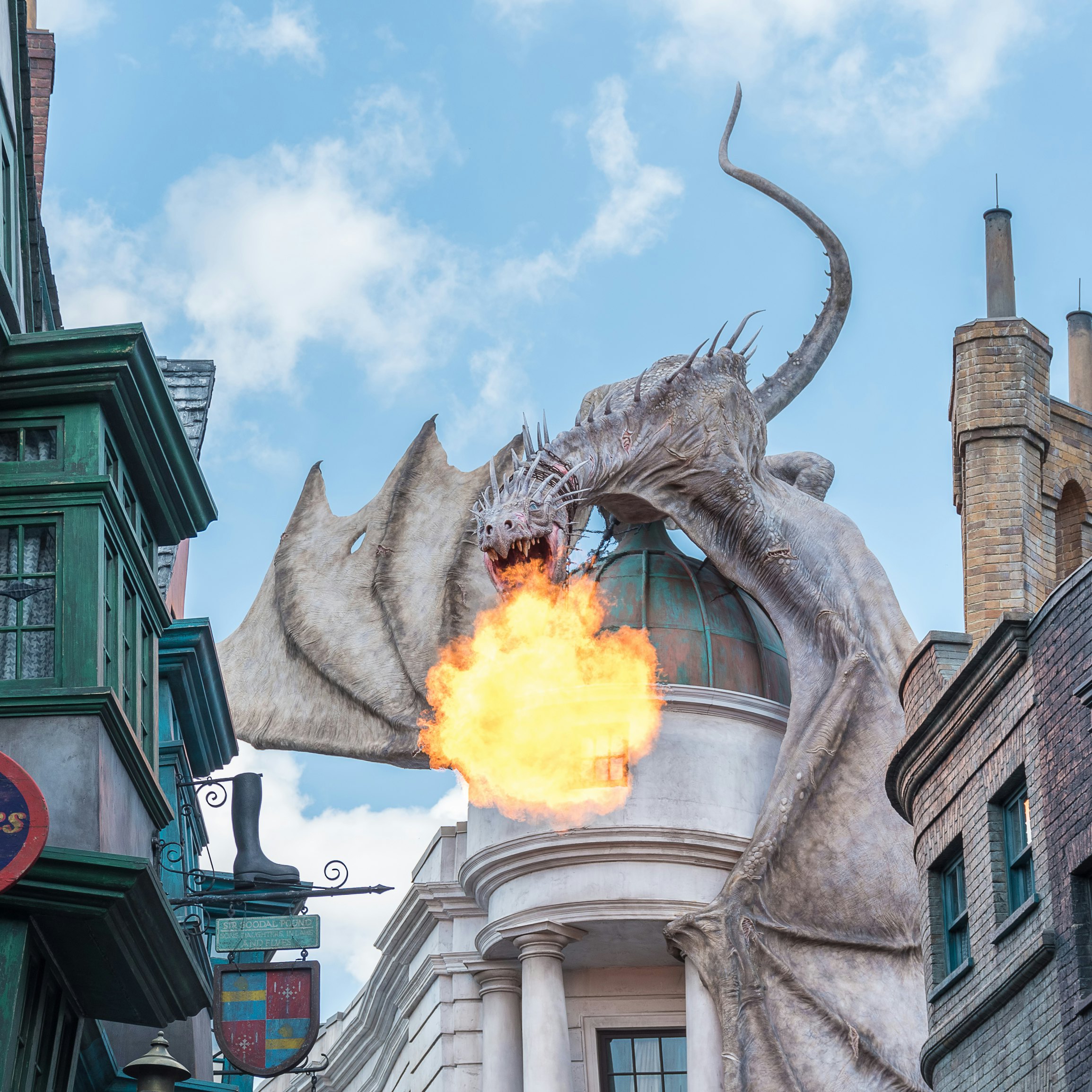 ORLANDO, USA - SEPTEMBER 02, 2015: Gringotts Bank Dragon breathing fire The Wizarding World Of Harry Potter at Universal Studios Orlando. Universal Studios Orlando is a theme park in Orlando, Florida.