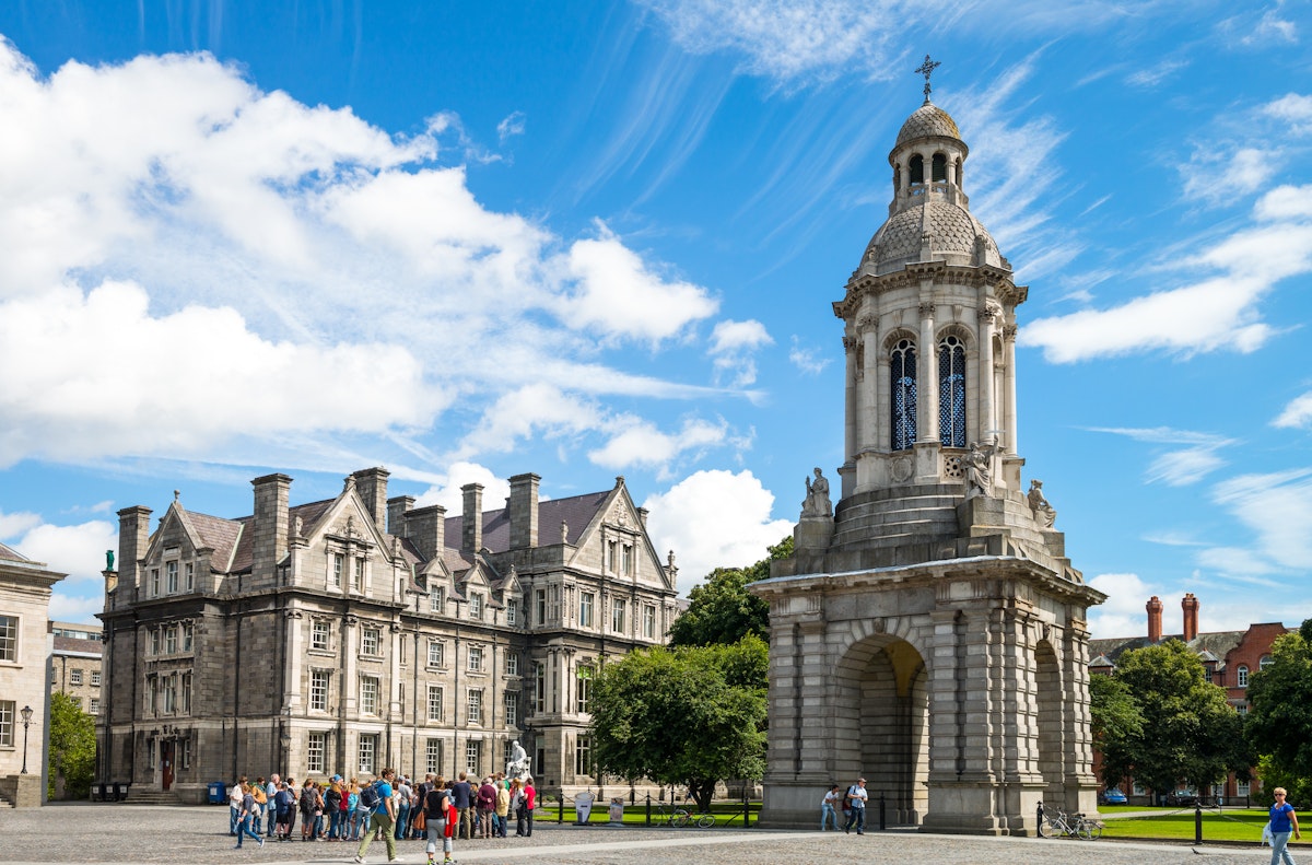 Dublin, Ireland - August 3, 2013: Visitors under the Campanile of the Trinity College