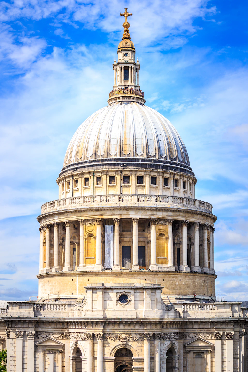 The dome of St Paul's A huge church building with a single large dome with columns around the outside