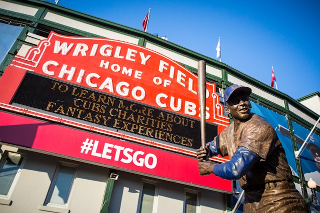 Exterior of Wrigley Field, Chicago, with a statue of baseball star Ernie Banks.