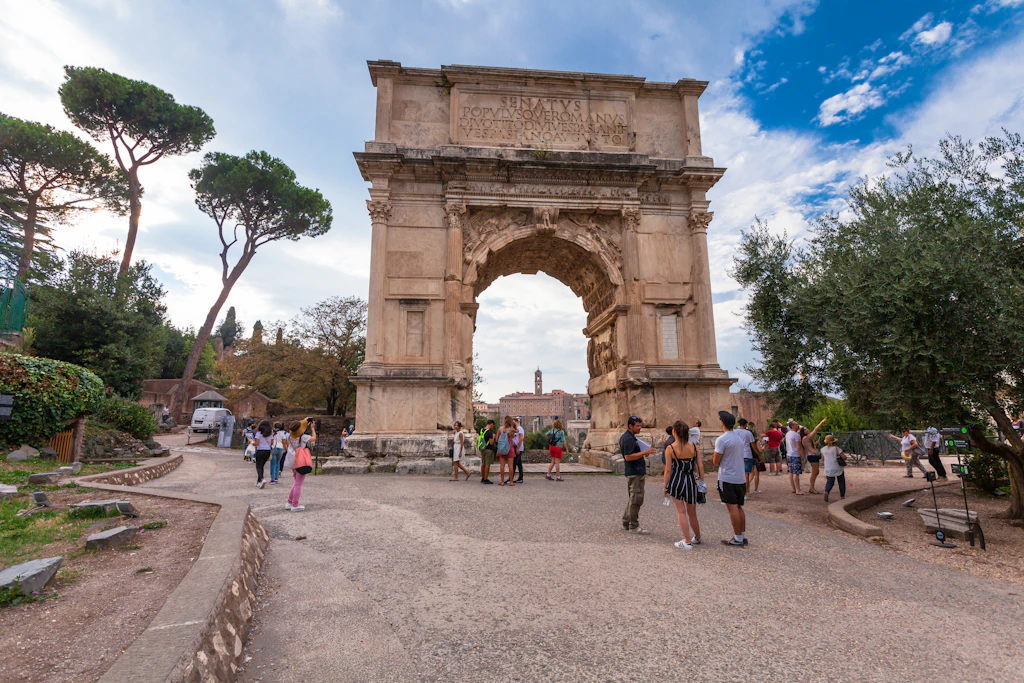 The Arch of Titus in Rome Tourists visit the Arch of Titus in Rome