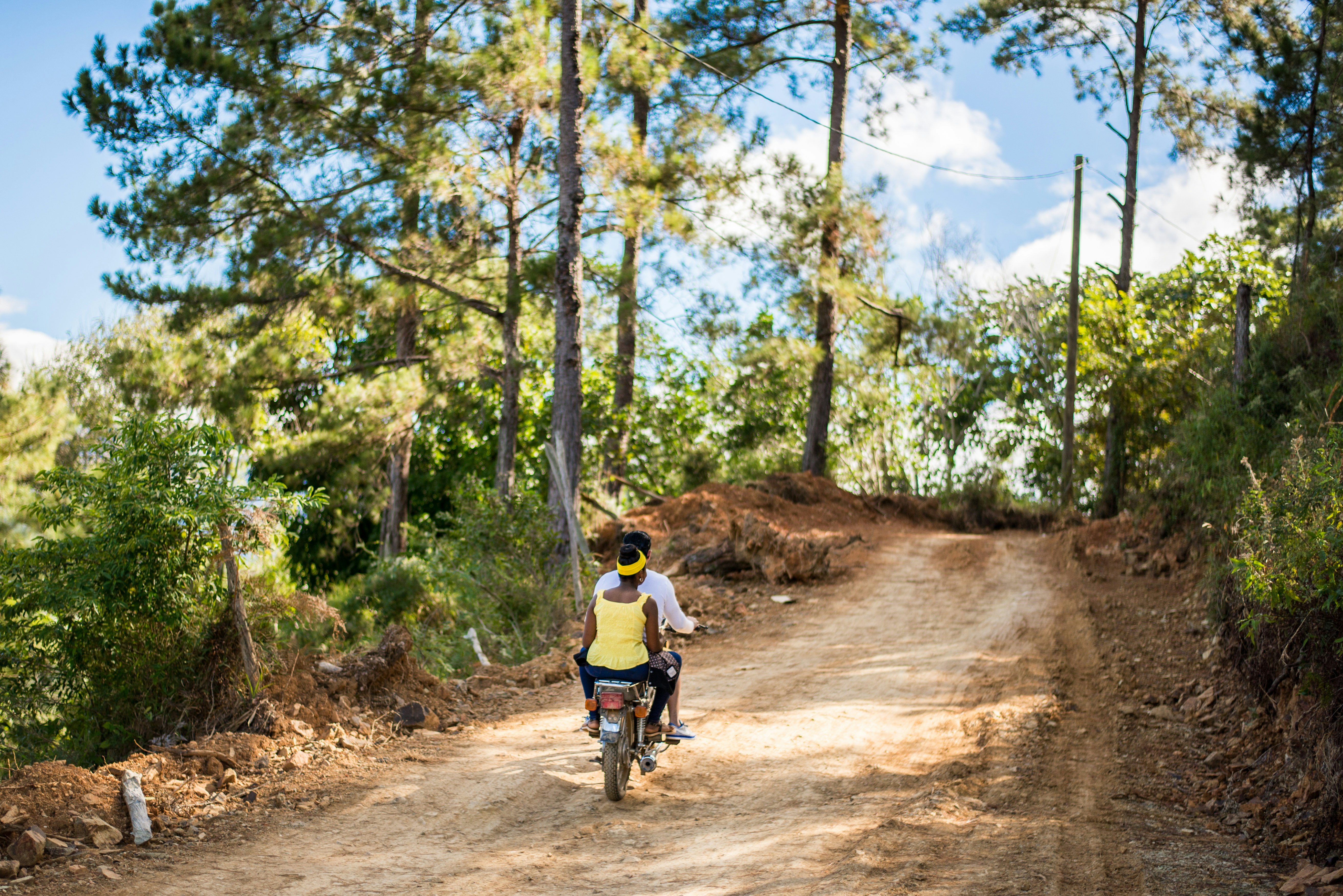 Bike riders cycling through the countryside of Dominican Republic