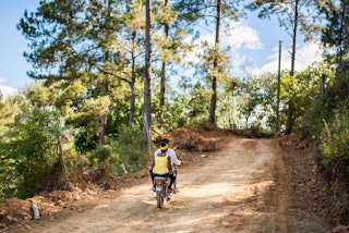 Bike riders on a joyride through the countryside of Dominican Republic.