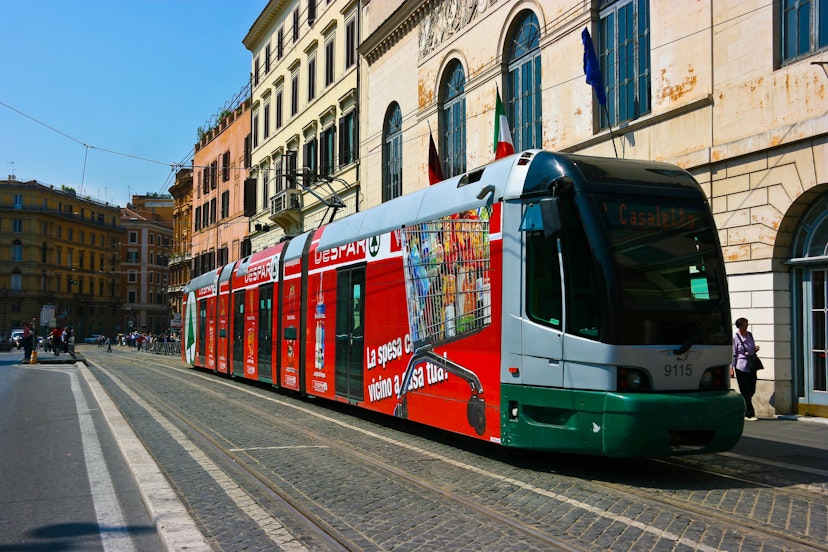 ROME, ITALY - MAY 22 : Tram picks up the passengers on the strreet of Rome on May 22, 2011. Public Transportion includes metro, buses and trams.