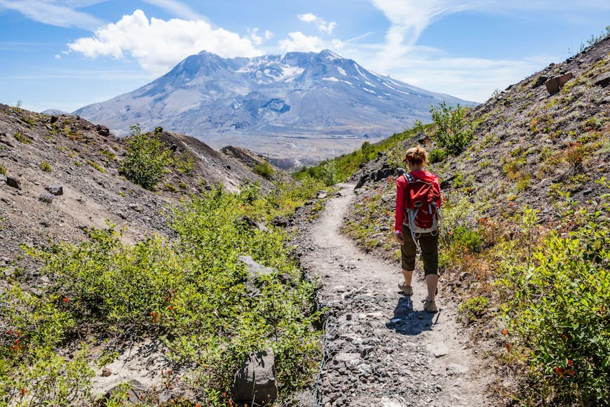 A woman hiking in Mt St Helens National Monument, Washington, USA.