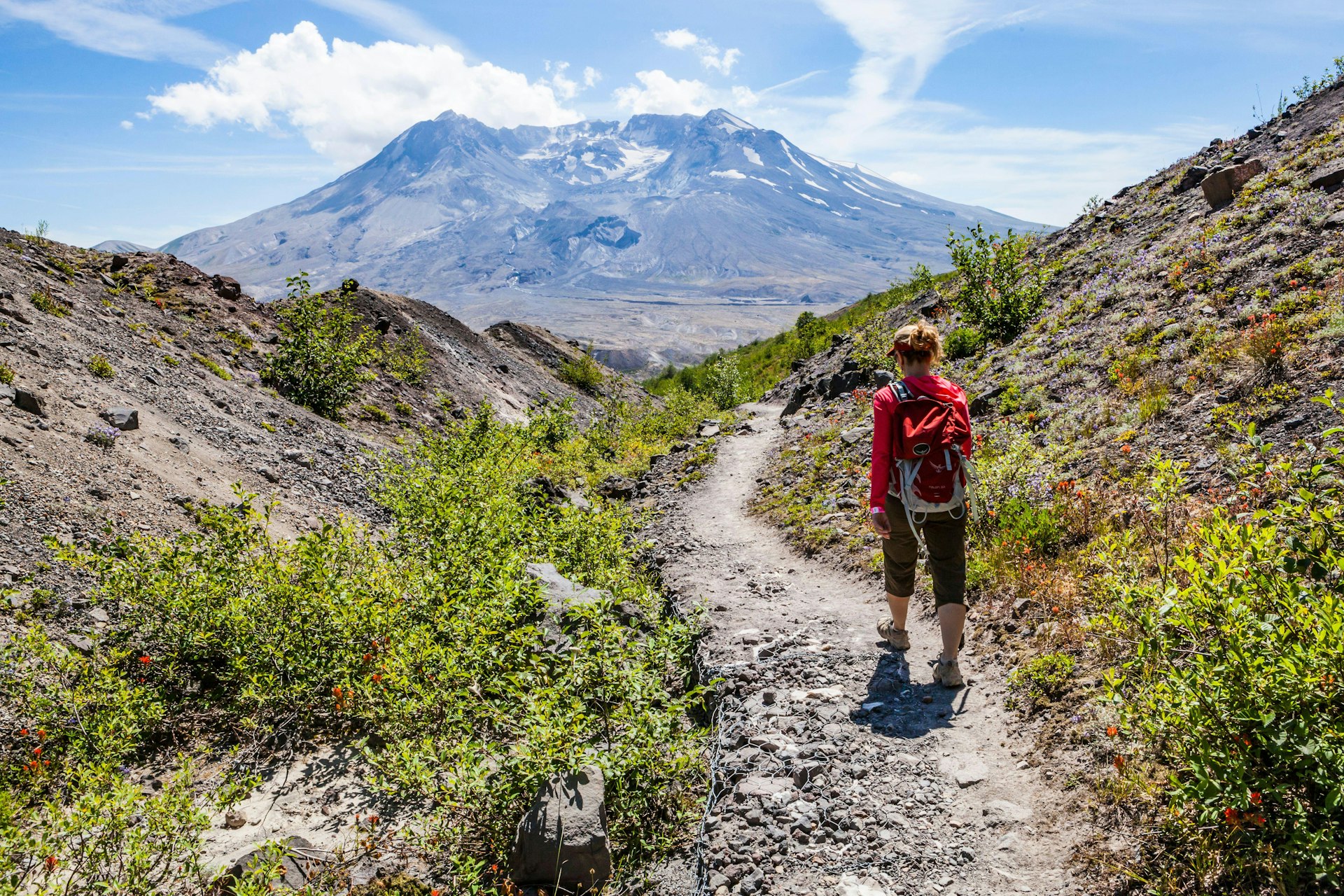 A woman hiking in Mt St Helens National Monument, Washington, USA.
