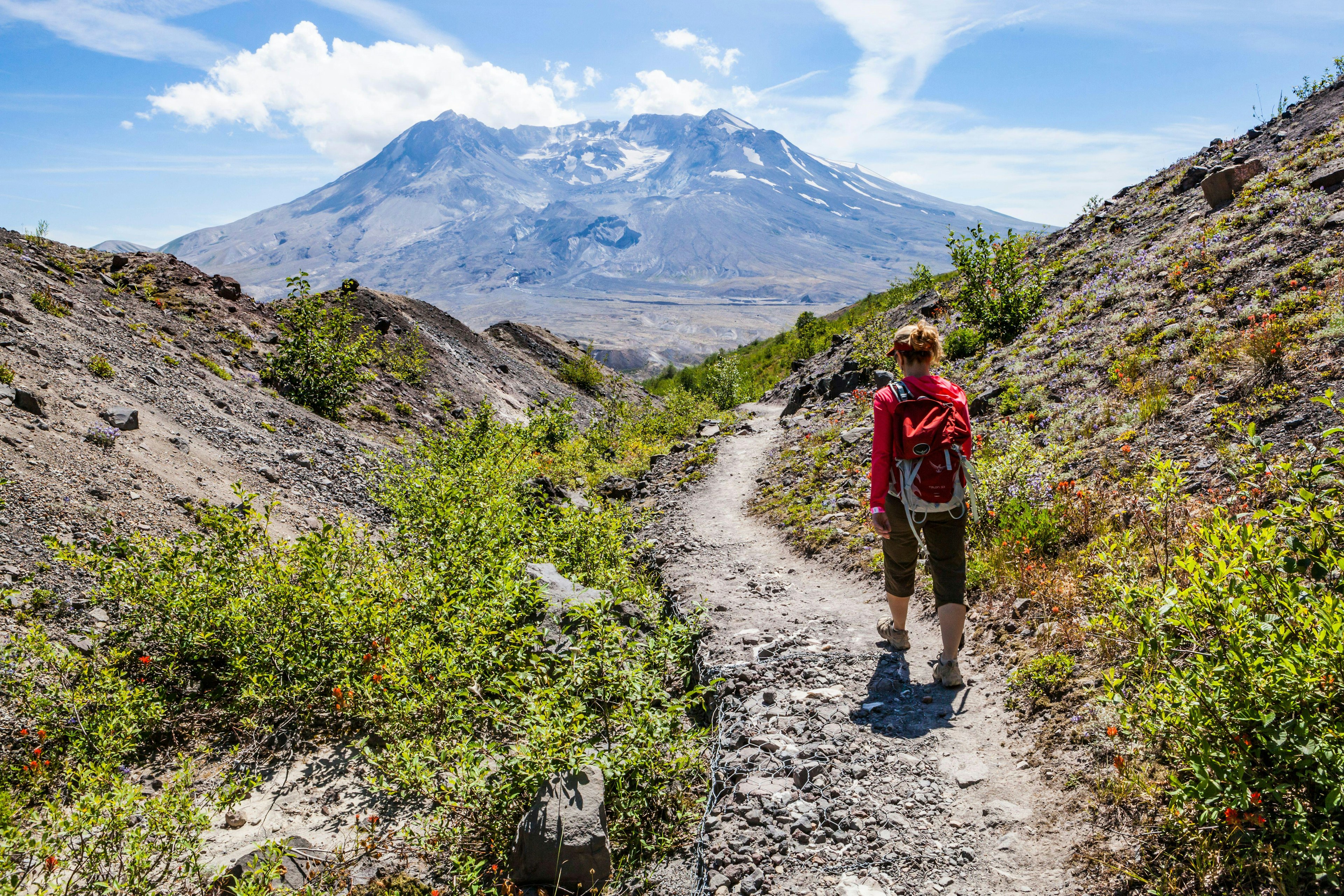 A woman hiking in Mt St Helens National Monument, Washington, USA.