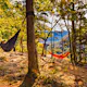 Two hikers hammock along Whitaker Point Trail; Shutterstock ID 1829809304; your: Ben N Buckner; gl: 65050; netsuite: Client Services; full: Arkansas Outdoor Adventures