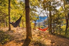 Two hikers hammock along Whitaker Point Trail; Shutterstock ID 1829809304; your: Ben N Buckner; gl: 65050; netsuite: Client Services; full: Arkansas Outdoor Adventures