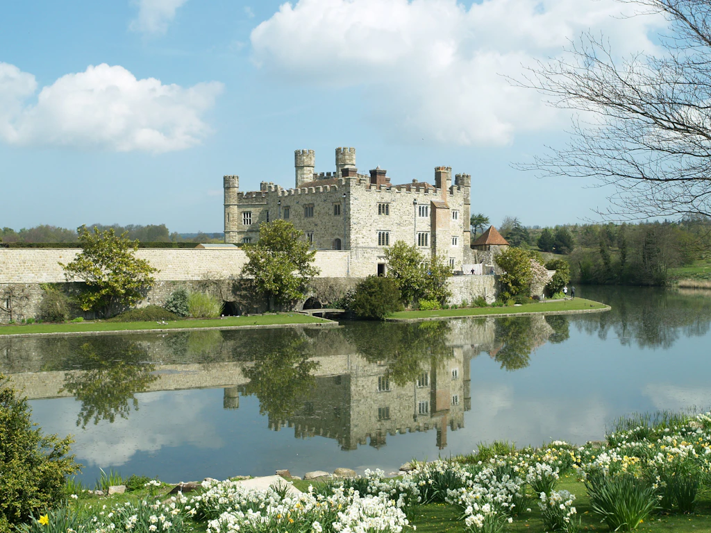 A stone castle surrounded by a moat