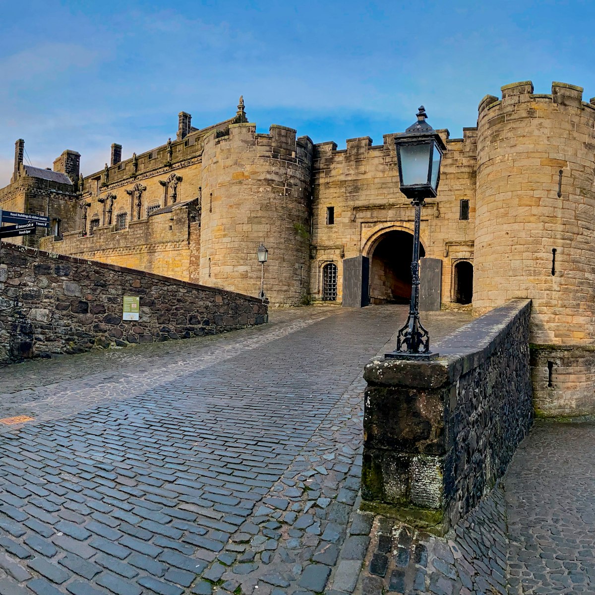 Stirling, Scotland, United Kingdom – December 20, 2019: Stirling Castle is a fortified wall sitting atop Castle Hill and is part of the Stirling Sill, a quartz-dolerite formation millions of years old. Records date it back to the early 12th century and the inner grounds are home to replicas of the famous Unicorn Tapestries. The castle offers spectacular views of Stirling from the Outer Defences.