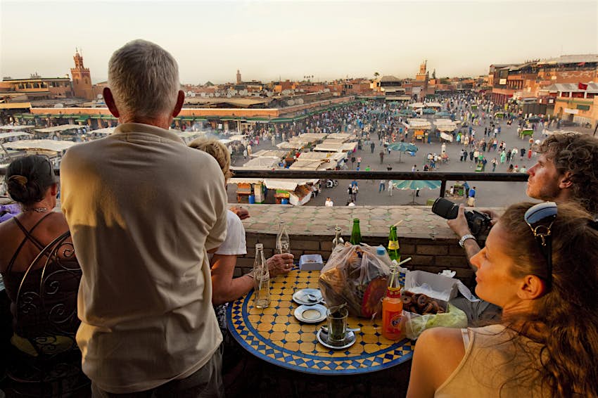Visitors at a terrace above Djemaa El Fna square in Marrakesh, Morocco