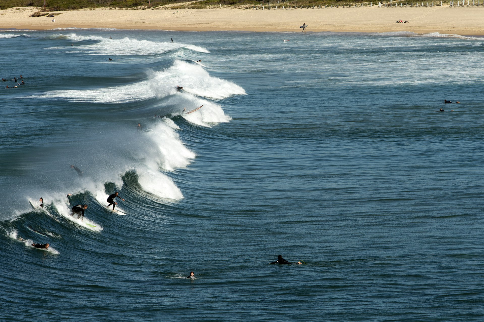 Surfers on a wave at Maroubra Beach in Sydney, Australia